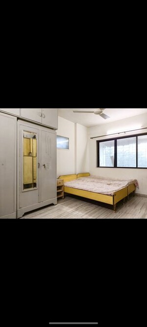 Bedroom in 2 BHK Apartment at Hatkesh CHS, Vile Parle West – for Rent