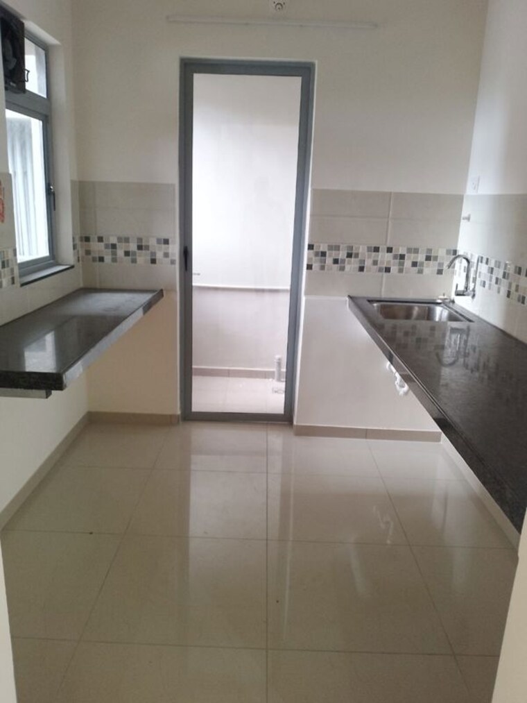 Kitchen, mahindra-happinest-tathawade-phase-1 2 Bedroom 670 Sq.Ft. Apartment In Tathawade Pune 10639500