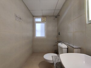 Bathroom in  Apartment at Bhartiya Nikoo Homes Phase 2, Thanisandra Main Road – for Rent