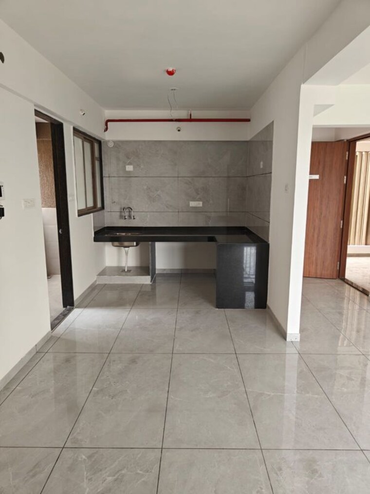 Kitchen, renuka-panchtattva 2 Bedroom 826 Sq.Ft. Apartment In Tathawade Pune 10639854