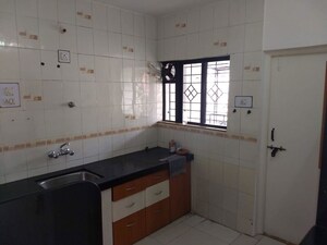 Kitchen in 2 BHK Apartment at Rahul Atul Nagar CHS, Warje – for Rent