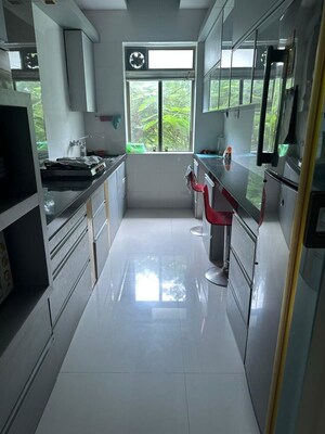 Kitchen in 2 BHK Apartment at Shyam Niwas CHS, Cumbala Hill – for Sale