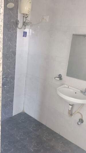 Bathroom in 2 BHK Apartment at Benhur CHS LTD, Andheri West – for Rent