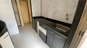 Kitchen in 1 BHK Apartment at Om Prabhu Manohar CHS, Seawoods Sector 50 – for Sale