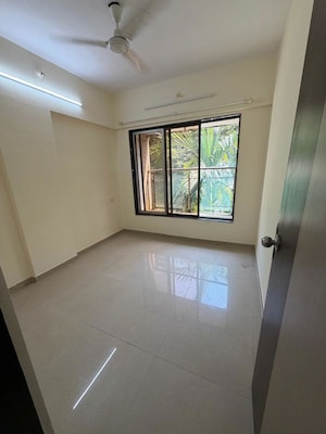 Bedroom in 3 BHK Apartment at Awadhoot CHS, Andheri West – for Rent