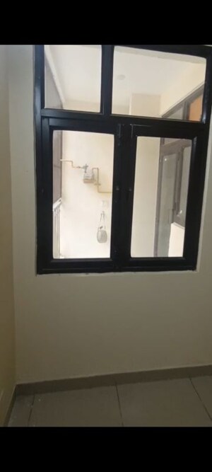 Room in 2 BHK Apartment at Charms Castle, Raj Nagar Extension – for Rent