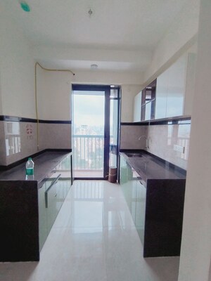 Kitchen in 1 RK Apartment at Dhamji Shamji Mahavir Spring Tulip Phase 1, Pokhran Road No Two – for Rent