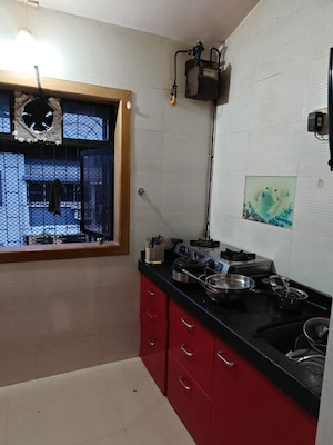 Kitchen in 3 BHK Apartment at Riddhi Garden, Malad East – for Rent