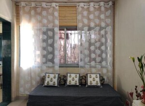 Living Room in 1 BHK Apartment at Juhu – for Rent