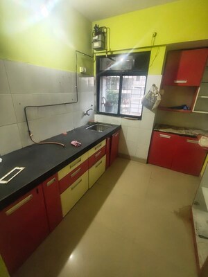 Kitchen in 2 BHK Apartment at Ram Pushpanjali Residency, Owale – for Rent