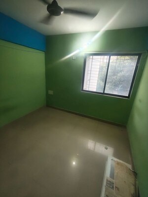 Master Bedroom in 2 BHK Apartment at Ram Pushpanjali Residency, Owale – for Rent