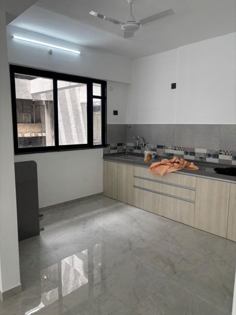 Kitchen, unique-youtopia 2 Bedroom 1000 Sq.Ft. Apartment In Kharadi Pune 10641200