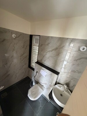 Bathroom in 1 BHK Apartment at MICL Aaradhya Parkwood, Mira Road – for Rent
