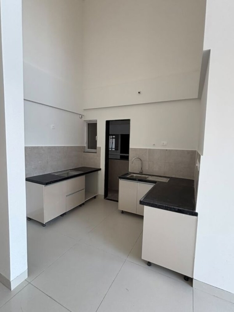 Kitchen, gera-planet-of-joy 2 Bedroom 1076 Sq.Ft. Apartment In Kharadi Pune 10641974