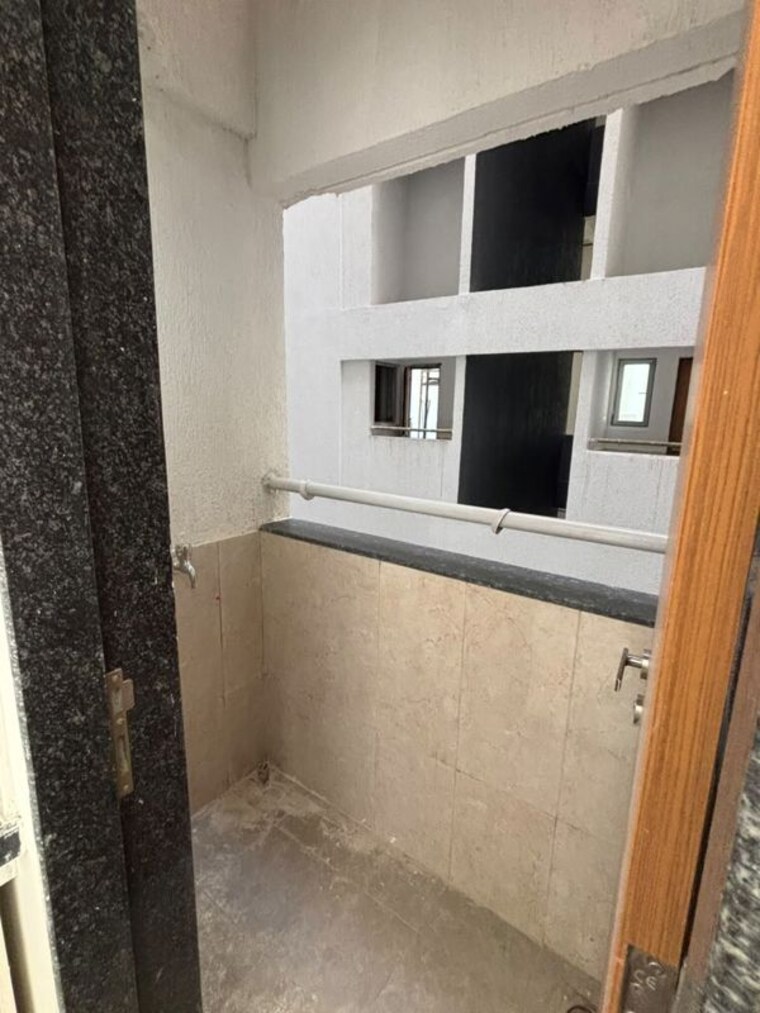 Kitchen, gera-planet-of-joy 2 Bedroom 1076 Sq.Ft. Apartment In Kharadi Pune 10641974