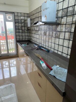 Kitchen in 2 BHK Apartment at Paradise Lifespaces Sai World City, New Panvel – for Rent
