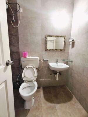 Bathroom in 3 BHK Apartment at Kolte Patil Margosa Heights, Mohammadwadi – for Rent