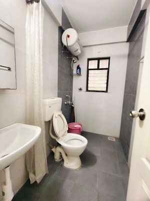 Bathroom in 3 BHK Apartment at Kolte Patil Margosa Heights, Mohammadwadi – for Rent