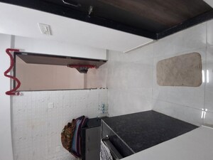 Kitchen in 1 BHK Apartment at Unique Shanti The Sky Line, Mira Road – for Rent