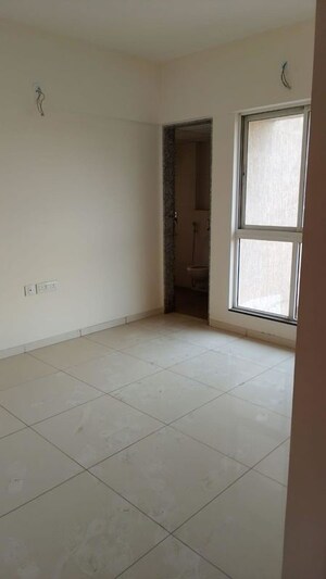 Room in 2 BHK Apartment at Godrej Nirvaan, Themghar – for Sale