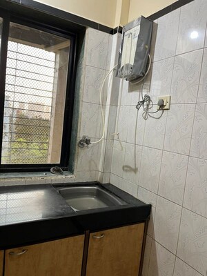 Kitchen in 1 BHK Apartment at Gayatri Corner, Kandivali East – for Rent
