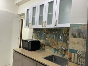 Kitchen in 1 BHK Apartment at Mahavir Kalpavruksha, Ghodbunder Road – for Rent