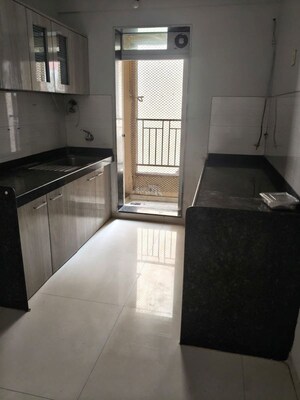 Kitchen in 2 BHK Apartment at Dosti Tulip, Balkum Pada – for Rent