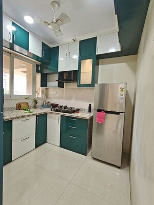 Kitchen in 2 BHK Apartment at Conwood Enclave, Vasant Vihar – for Rent
