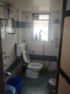 Bathroom in 1 BHK Apartment at Lalani Residency, Kavesar – for Rent