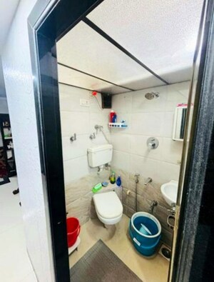 Bathroom in 2 BHK Apartment at Oscar Om Ambe Smruti, Mulund West – for Rent