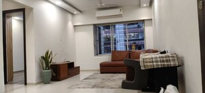 Living Room in 2 BHK Apartment at Indradarshan II, Oshiwara – for Rent