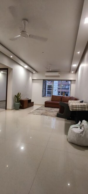 Living Room in 2 BHK Apartment at Indradarshan II, Oshiwara – for Rent