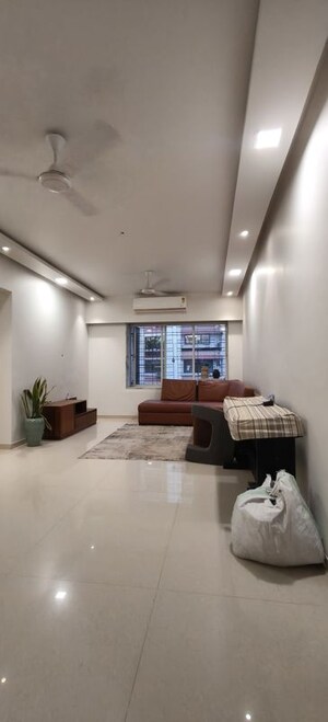 Living Room in 2 BHK Apartment at Indradarshan II, Oshiwara – for Rent