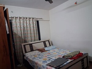 Bedroom in 2 BHK Apartment at Karan Gharonda, Wadgaon Sheri – for Rent
