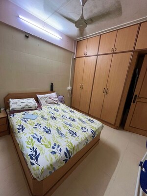 Bedroom in 1 BHK Apartment at Kaustubh Usha Colony CHS, Malad West – for Rent