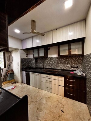 Kitchen in 2 BHK Apartment at Maharaja Retreat CHS, Goregaon East – for Rent