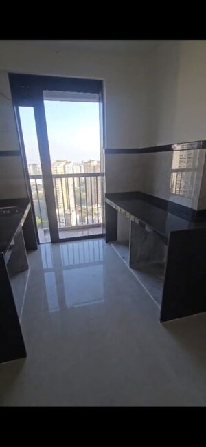 Kitchen in 2 BHK Apartment at Dhamji Shamji Mahavir Spring Tulip Phase 1, Pokhran Road No Two – for Sale