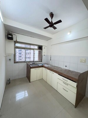 Kitchen in 2.5 BHK Apartment at Kanakia Spaces Niharika, Manpada – for Sale