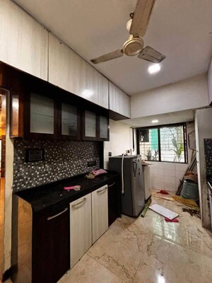 Kitchen in 2 BHK Apartment at Maharaja Retreat CHS, Goregaon East – for Rent