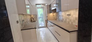 Kitchen in 3 BHK Builder Floor at Ansal Sushant Lok I, Sector 43 – for Sale