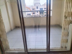 Terrace in 2 BHK Apartment at Dorabjee Enclave, Salunkhe Vihar Society – for Rent