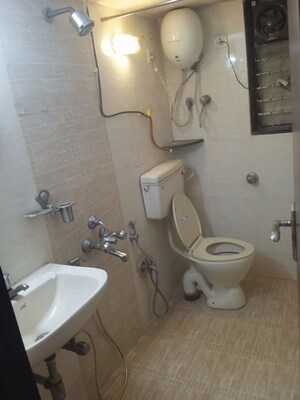 Bathroom in 2 BHK Apartment at Satellite Garden, Goregaon East – for Rent