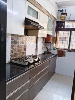 Kitchen in 2 BHK Apartment at Raunak Unnathi Woods Phase 4 And 5, Ghodbunder Road – for Sale