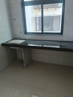 Kitchen in 2 BHK Apartment at Gagansagar CHS, Eksar – for Sale