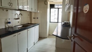 Kitchen in 1 BHK Apartment at Apeksha CHS, Andheri West – for Sale