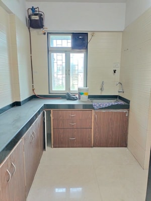 Kitchen in 1 BHK Apartment at Cosmos Classique, Ghodbunder Road – for Sale