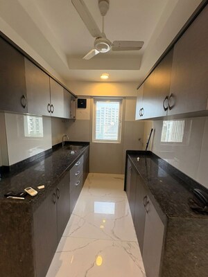 Kitchen in 2 BHK Apartment at Oshiwara Basera CHS, Andheri West – for Rent