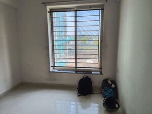 Room in 2 BHK Apartment at Kolte Patil Little Earth, Kiwale – for Rent