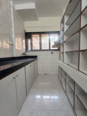 Kitchen in 2 BHK Apartment at Serenity Heights, Malad West – for Rent