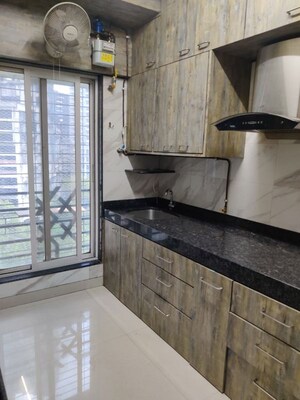 Kitchen in 2 BHK Apartment at Evershine Grandeur, Malad West – for Rent